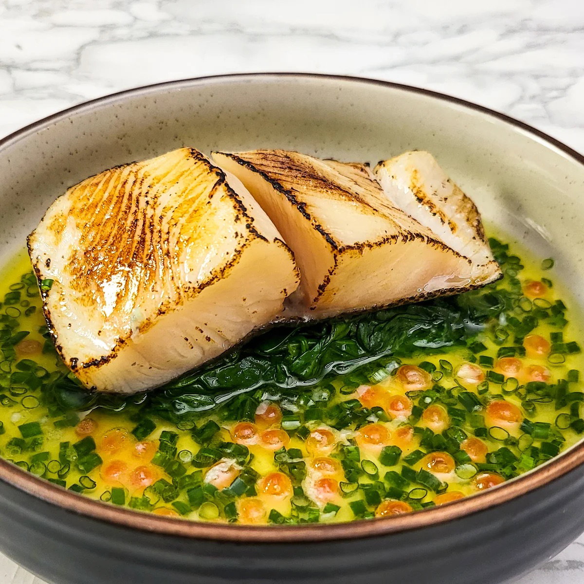shio Koji Black cod on greens