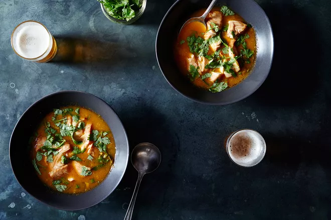 Two bowls of Roasted Black Cod in Ginger Cilantro Broth on black counter